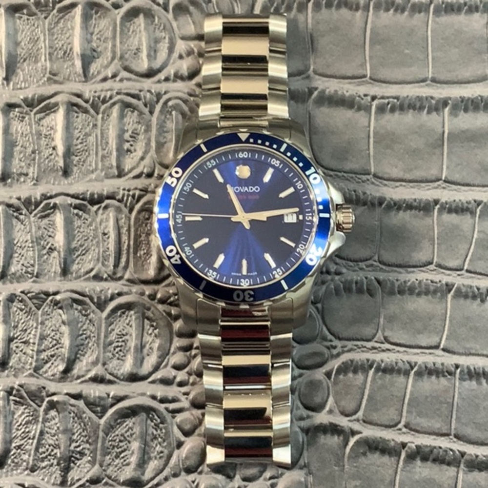 Movado series 800 blue dial stainless mens watch.